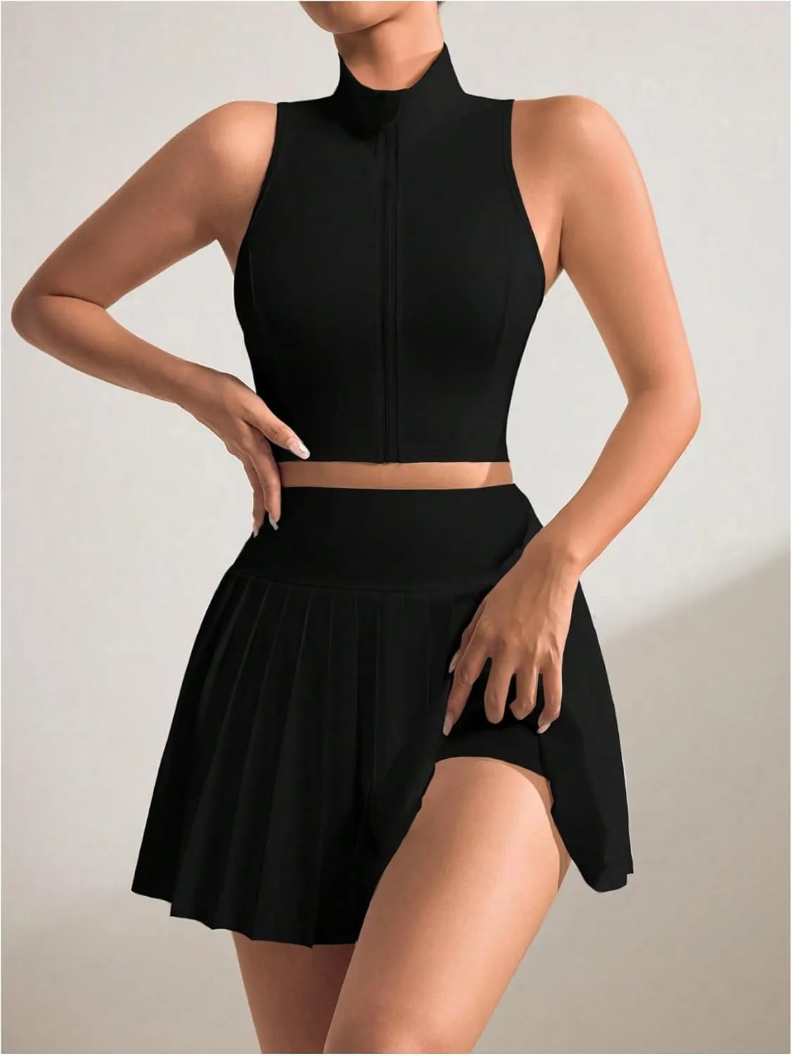 MakeMeChic Women's 2 Piece Athletic Outfit Mock Neck Full Zip Vest Crop Tops and Pleated Skirt Set